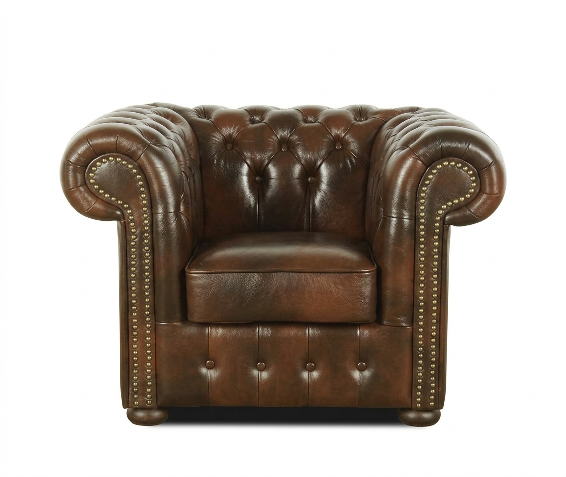 Brown leather armchair with tufted backrest and nailhead trim on a white background