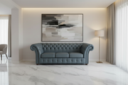 Modern living room with a gray sofa, abstract painting, and floor lamp.