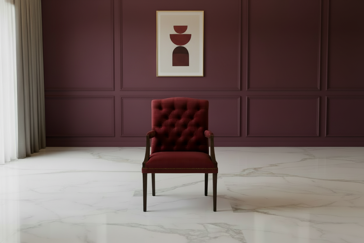 Red upholstered chair with wooden armrests and legs on a white background